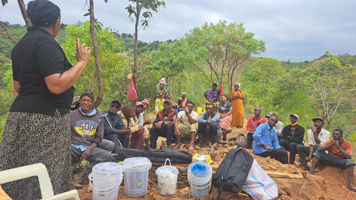Community members attend a teaching session on mushroom and vegetable cultivation